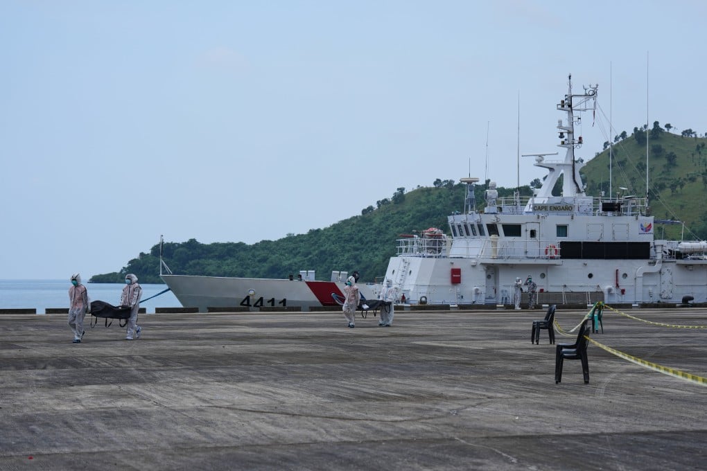 Rescuers carry the remains of victims of the recent fire on the MV June Aster ferry as they arrive on board a Philippine Coast Guard vessel at the Borac port in Coron, Palawan province, western Philippines on Saturday. Photo: AP