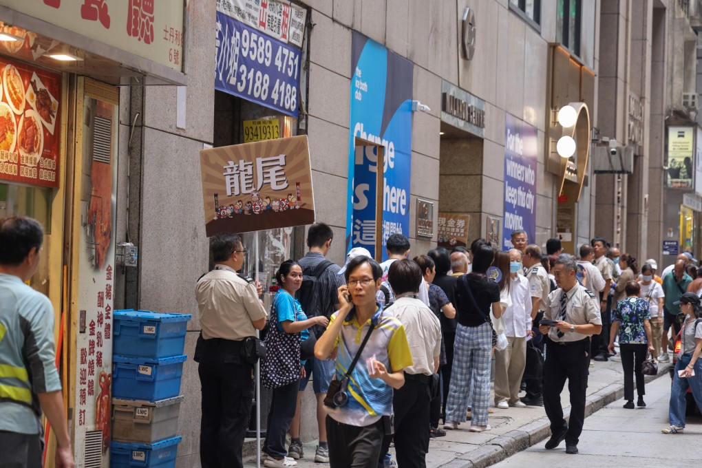 A queue outside the Hong Kong Jockey Club’s betting branch on Stanley Street in Central last Saturday. Nora Tam