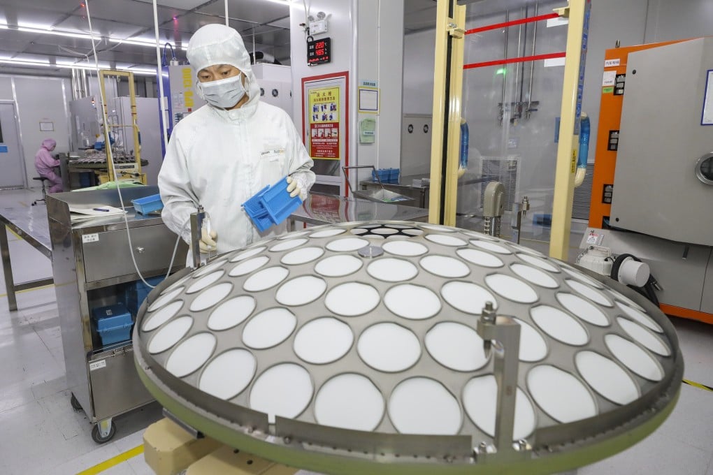 A worker produces chips for mobile phones, cars and LED lighting at a workshop in China’s Jiangsu province. Photo: Future Publishing via Getty Images