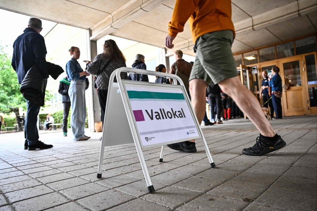People queue to vote for Sweden’s general election at a polling station in Stockholm, Sweden, on Sunday. Photo: AFP