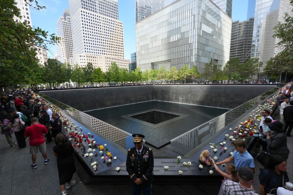 Visitors pay respects at the 9/11 memorial in New York on the 25th anniversary of the attacks. Photo: AP