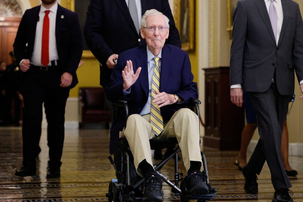 US Senator Mitch McConnell waves at reporters outside the Senate Chamber. Photo: Reuters
