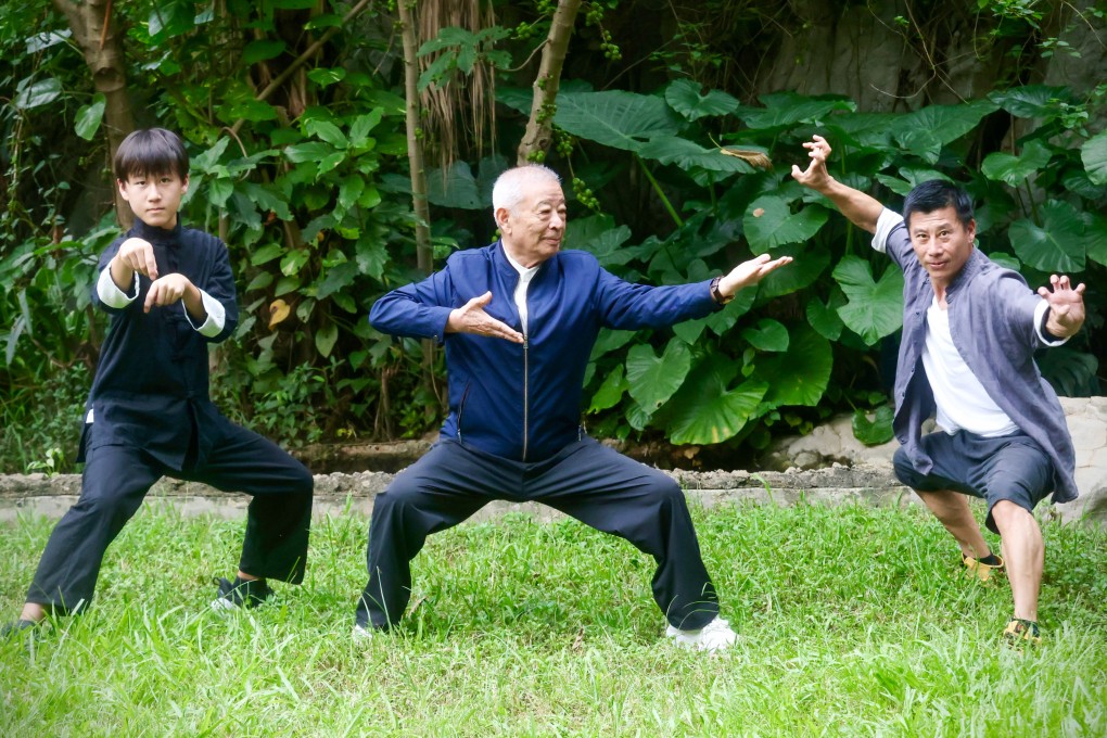 Legendary wushu trainer Wu Bin (middle) and martial artists Dragon He (left) and Jaden He Jingde practise martial arts in Hong Kong’s Wan Chai neighbourhood on August 17, 2026. Eighty-nine-year-old Wu talks about his journey in martial arts and shares secrets to staying in “great” health as we age. Photo: Jonathan Wong