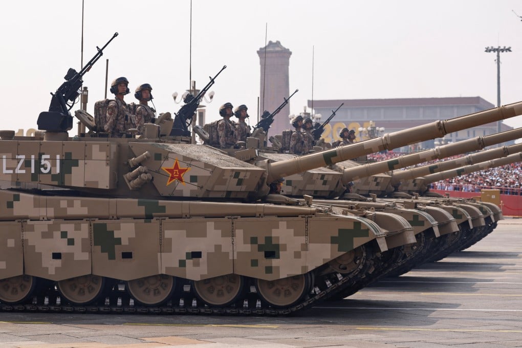 Members of the People’s Liberation Army Ground Assault Formation stand in open hatches of armoured vehicles during a military parade in Beijing on September 3, 2025. Photo: Reuters