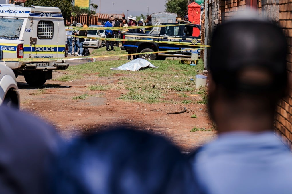 A body, believed to be that of a woman, is found along a road in Kwa-Thema, Springs, South Africa on Tuesday. Photo: AP