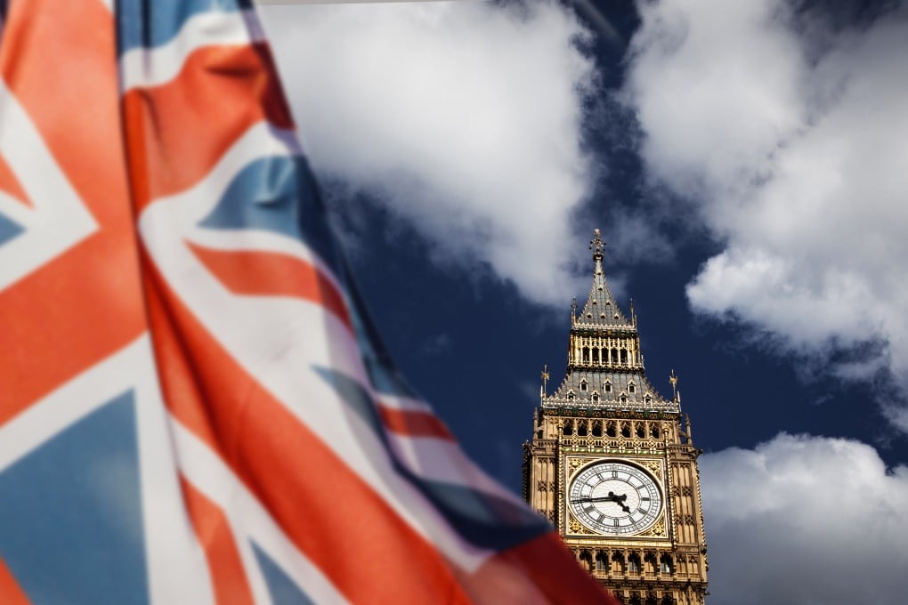A Union flag flies in front of Big Ben and the Houses of Parliament in London. Photo: Shutterstock