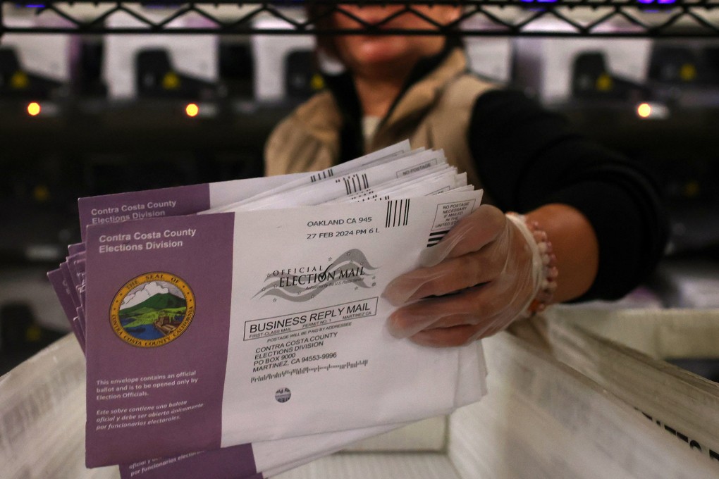 An election worker sorts mail-in ballots in 2024. Photo: TNS