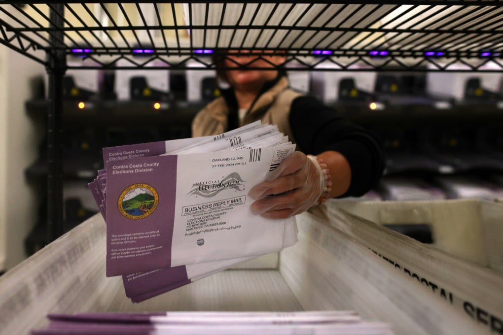 An election worker sorts mail-in ballots at a county elections centre in 2024. Photo: TNS