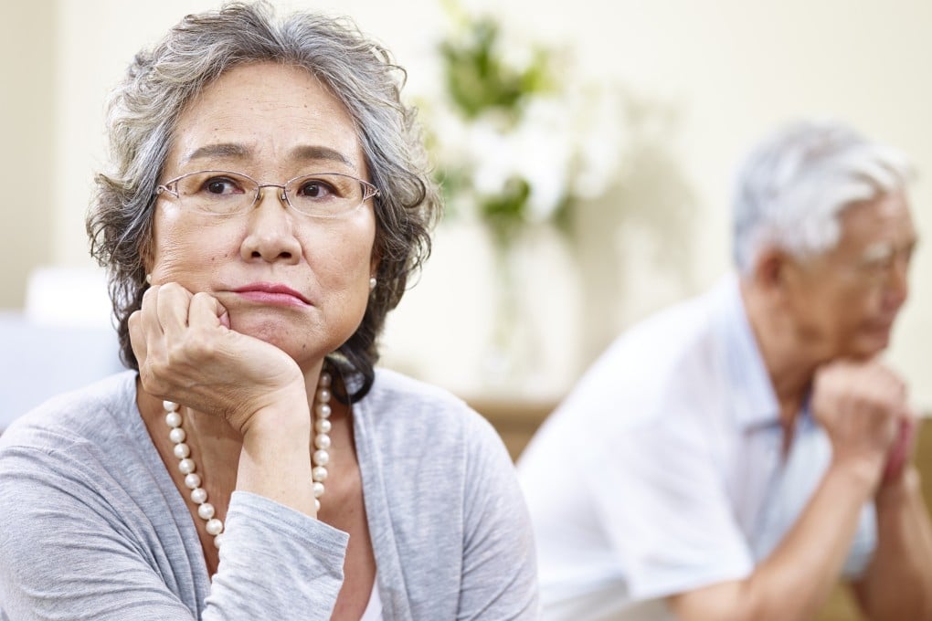 A senior couple sits on couch at home, angry at each other. A 90-year-old man is denied the maintenance he sought as an incapacitated former husband under the Women’s Charter. Photo: Shutterstock