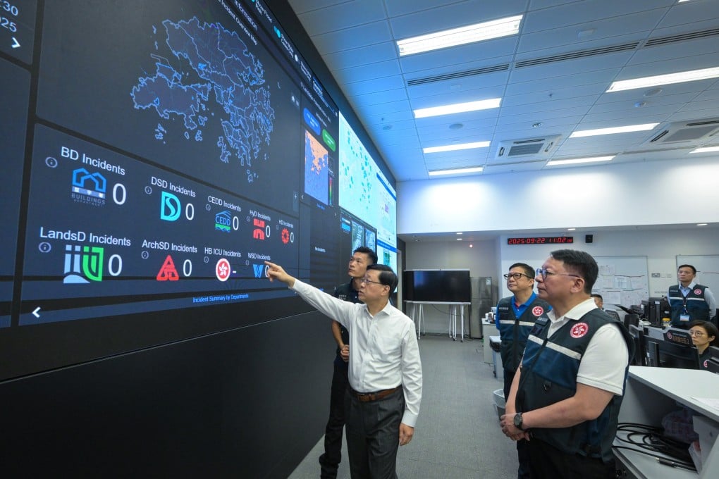 City leader John Lee (left) inspects the operation of the Security Bureau’s Emergency Monitoring and Support Centre. Also pictured are Chief Secretary Eric Chan (first right) and Secretary for Security Chris Tang Ping-keung (second right). Photo: Handout