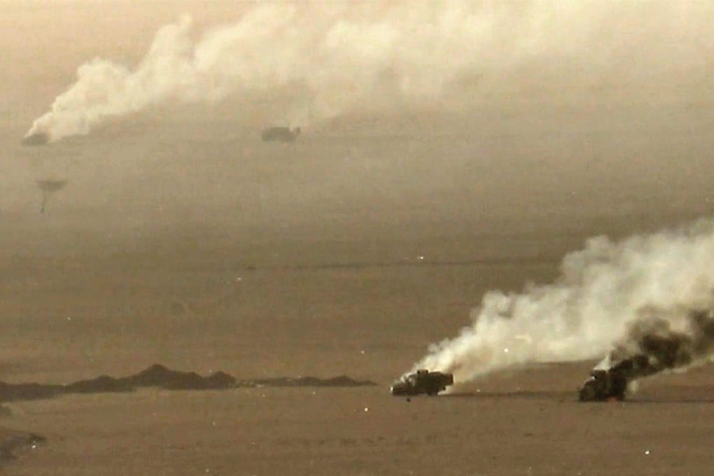 Burning military vehicles during fighting in al-Jawf governate, Yemen. Photo: Ansarullah Media Centre via AFP