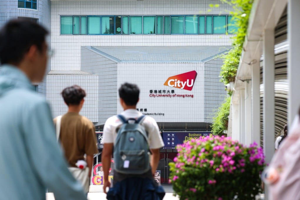 Students and staff pass through the main entrance of City University in Kowloon Tong on September 8. Photo: Silvia Siu