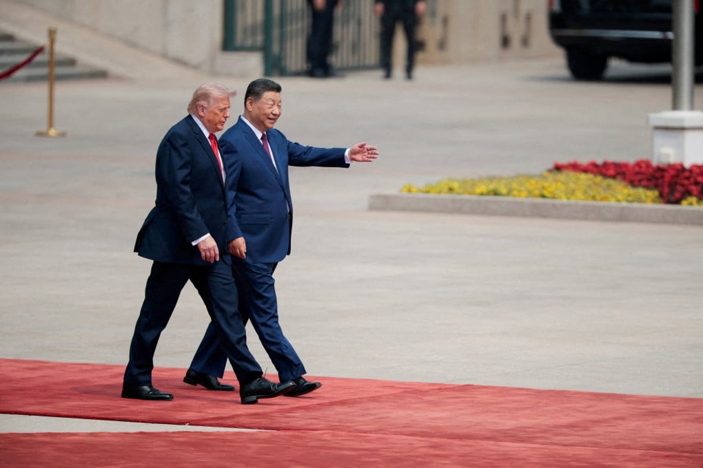 US President Donald Trump walks with President Xi Jinping upon arrival at the Great Hall of the People in Beijing on May 14. Photo: Reuters