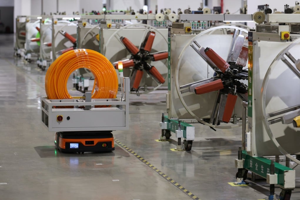An automated guided vehicle operates at the workshop of a building-materials company in northern China's Tianjin last month. The nation is looking to build more smart factories. Photo: Xinhua