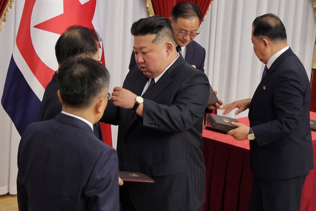North Korean leader Kim Jong-un (centre) meets scientists, researchers and officials from key national defence research institutions in Pyongyang on August 29. Photo: KCNA / Reuters