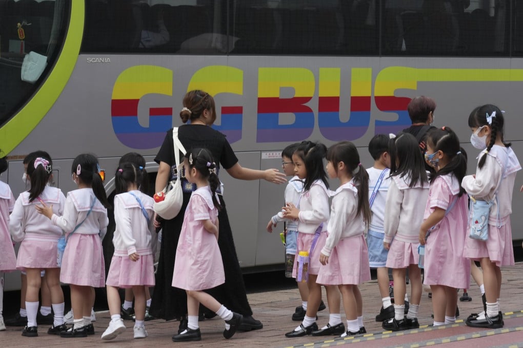 A group of kindergarten students queue up to board a bus for a school field trip, guided by their teacher, outside the Hong Kong Space Museum in Tsim Sha Tsui on May 19. Photo: Jelly Tse