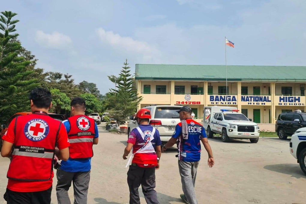 Emergency personnel walk at the site of a deadly shooting at a school in Banga, South Cotabato, Philippines, on Friday. Photo: Philippine Red Cross via Reuters