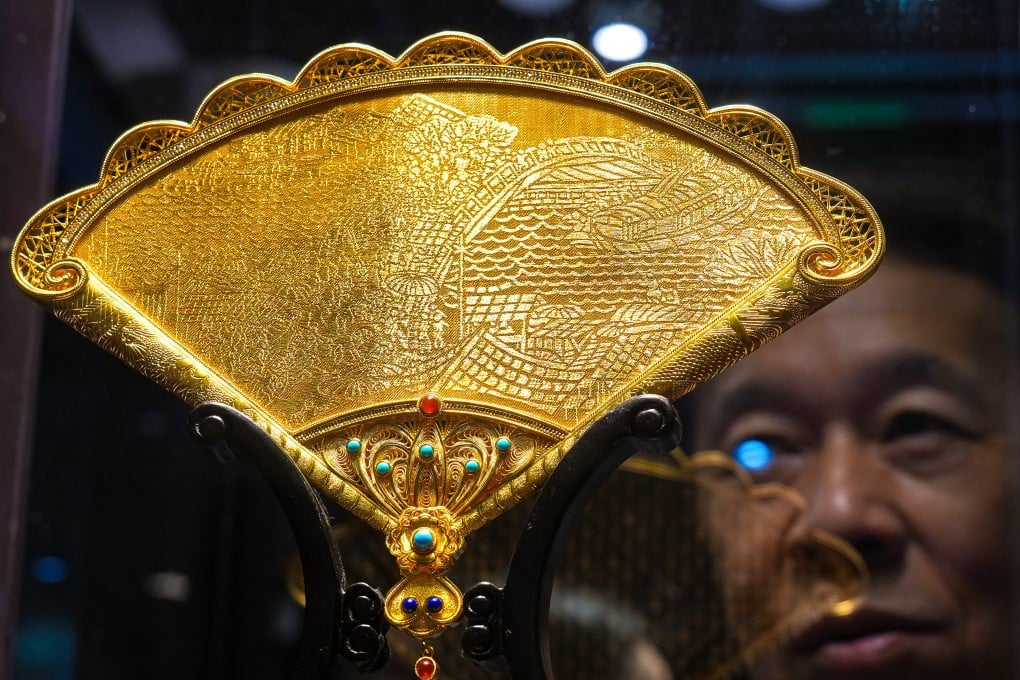 A pure gold decorative fan ornament at the Jewellery & Gem World Hong Kong fair at Hong Kong Convention and Exhibition Centre on Wednesday. Photo: Kit Lai