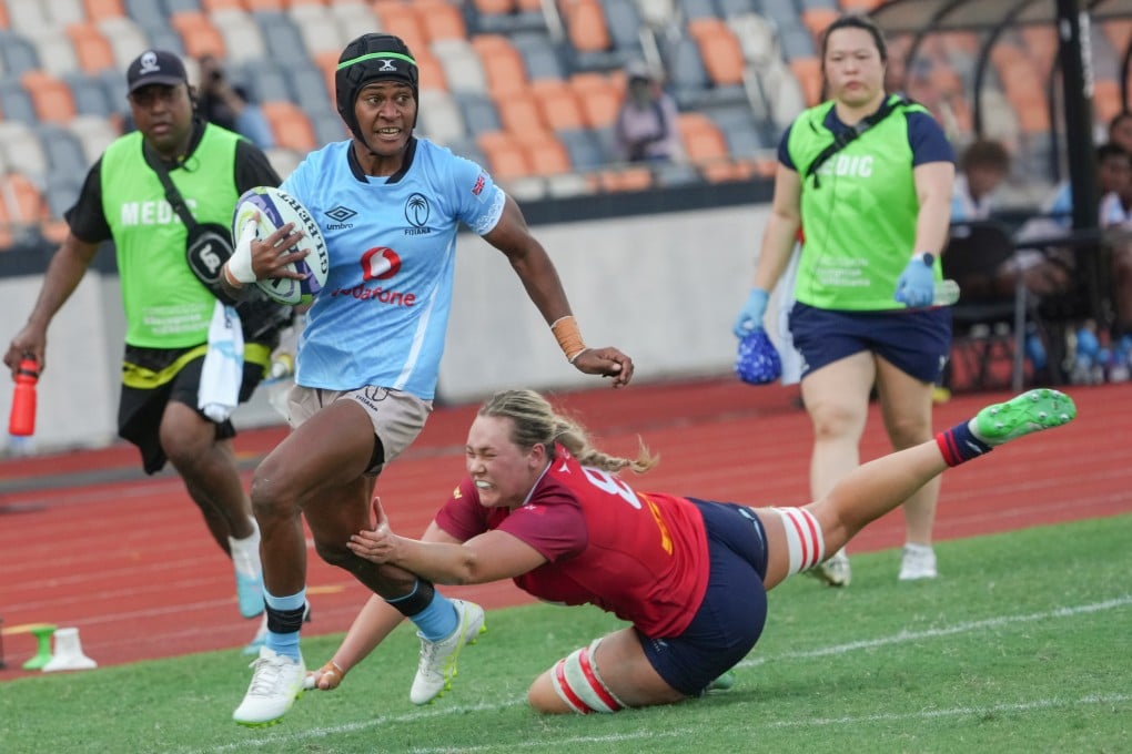 Fiji winger Atelaite Buna (left) evades the tackle of Hong Kong No 8 Grace Hood in her team's 54-26 win at Kai Tak Youth Sports Ground on Saturday. Photo: Dickson Lee