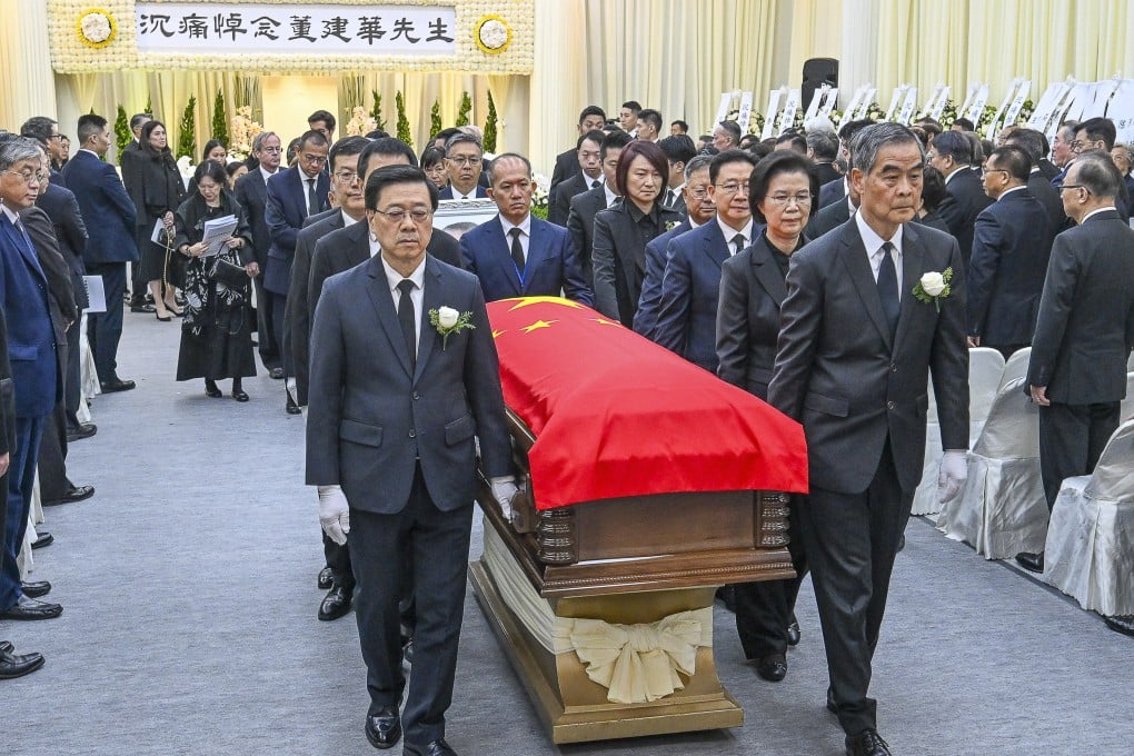 The coffin with the body of Tung Chee-hwa is carried by Hong Kong Chief Executive John Lee (front left pallbearer) and Leung Chun-ying, a CPPCC vice-chairman and former city leader, (front right pallbearer)
 at the Hong Kong Funeral Home in North Point on Sunday. Photo: Handout