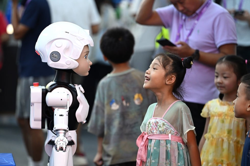 A girl interacts with a humanoid robot at the 23rd China-ASEAN Expo in Nanning, in south China’s Guangxi Zhuang Autonomous Region, on September 19, 2026. Photo: Xinhua