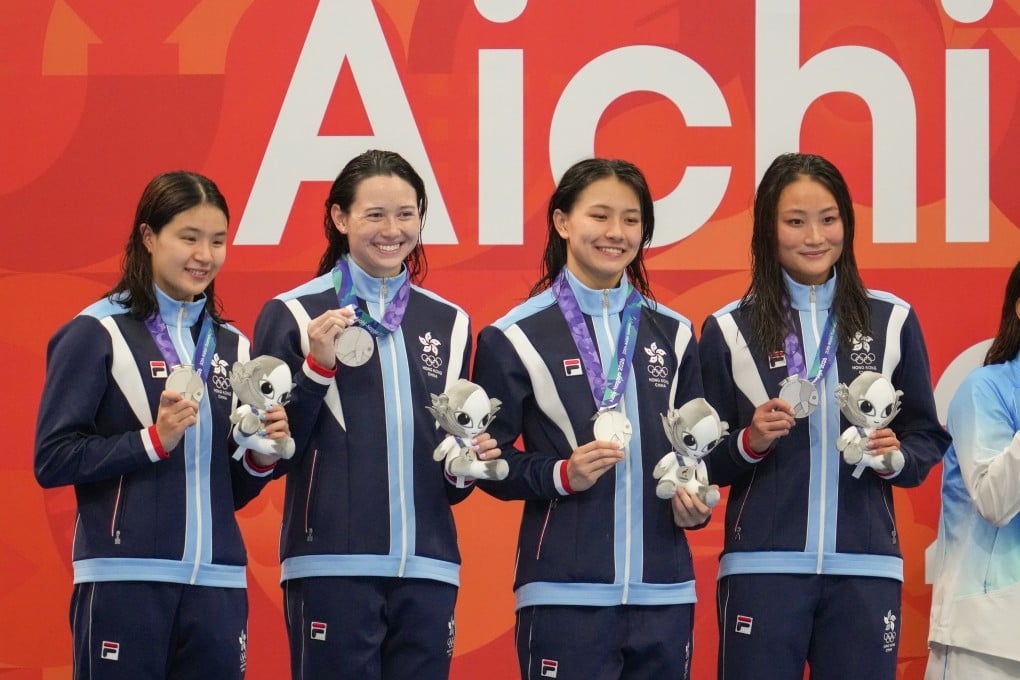 Hong Kong women’s 4x100m freestyle relay team celebrate after claiming silver at the Asian Games. Photo: Robert Ng