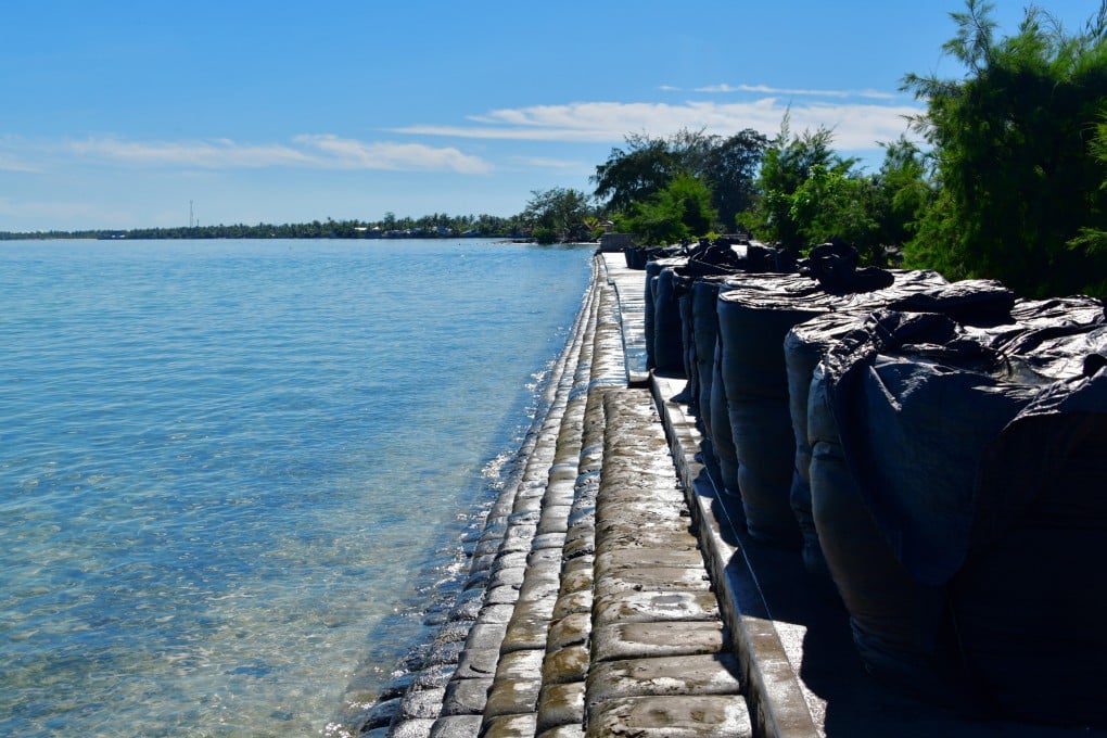 A sea-level rise and erosion barrier on the Stewart Causeway, Gilbert Island, Kiribati, where the average sea level has risen 3.2mm/year since 1993. Photo: Getty Images