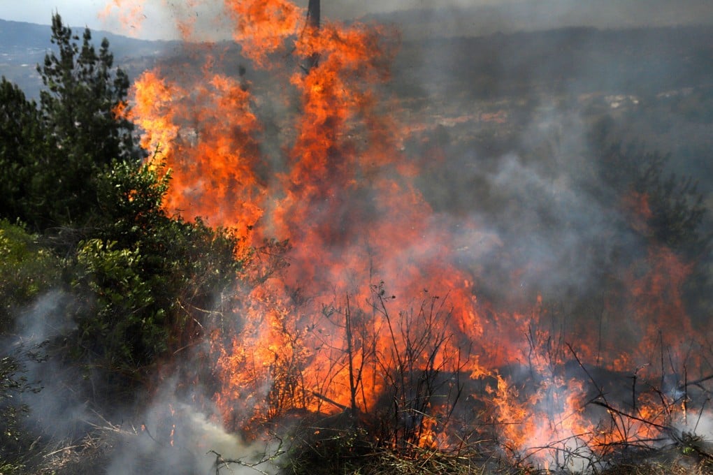 A wildfire burns amid high temperatures in Colombia on Sunday. Photo: AFP