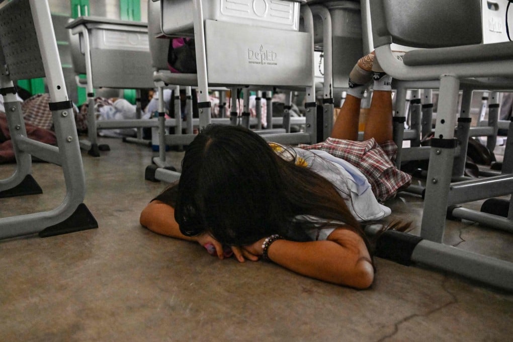 Students lay on the ground during an active shooter drill at a school in Bulacan province, the Philippines, on September 3. Photo: AFP