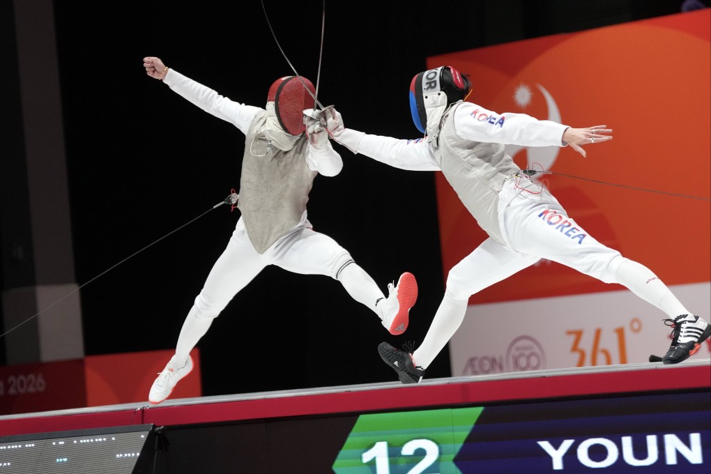 Ryan Choi (left) is through to the final of the men’s individual foil after beating South Korea’s Youn Jeong-hyun Photo: Sam Tsang