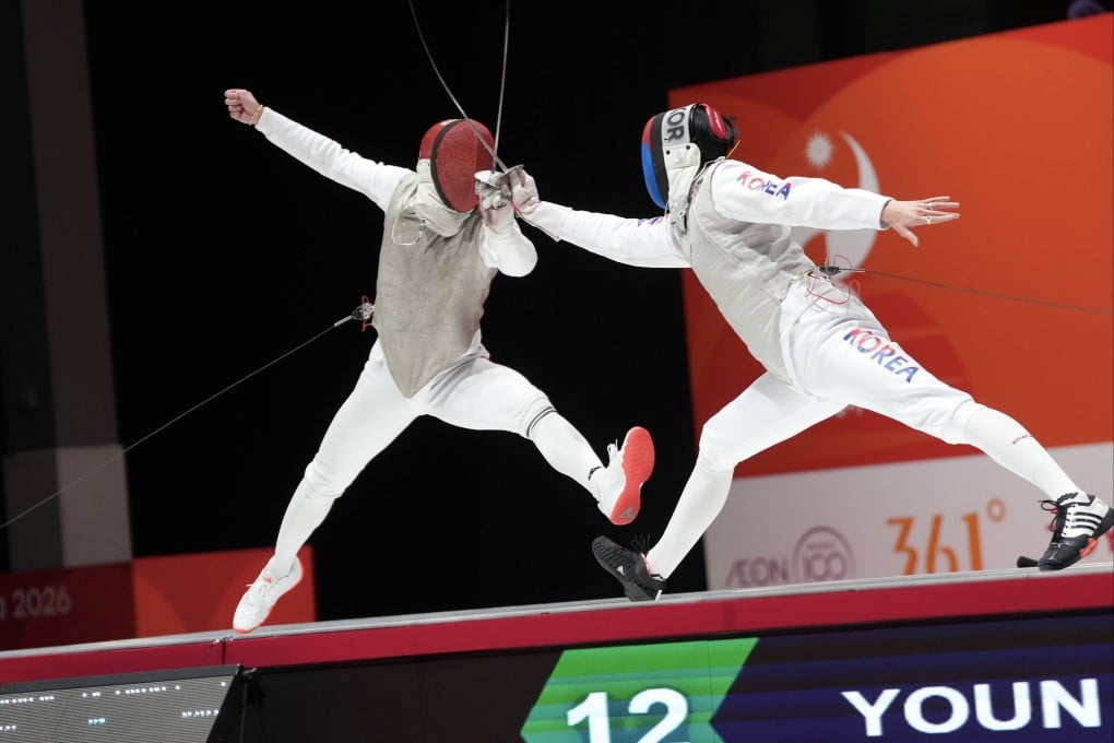 Ryan Choi (left) is through to the final of the men’s individual foil after beating South Korea’s Youn Jeong-hyun Photo: Sam Tsang