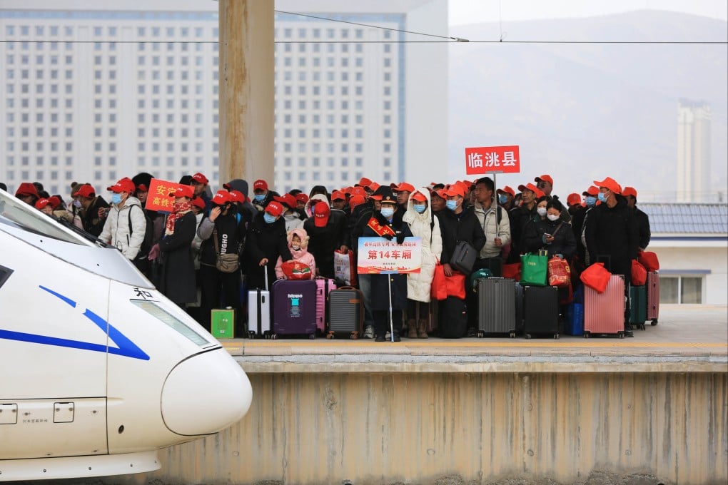 Migrant workers wait to board a chartered train at Dingxi North railway station in northwest China’s Gansu province, in 2024. 
In 2025, China’s nearly 300 million migrant workers earned just 5,075 yuan (US$758) a month on average, up only 2.3 per cent from the previous year. Photo: Xinhua