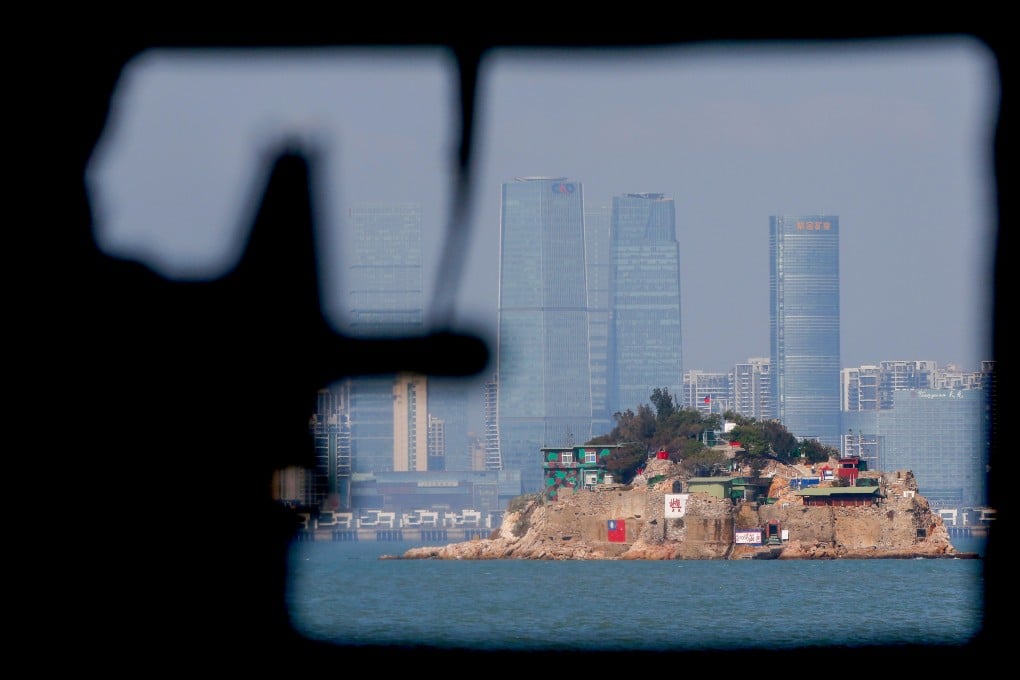 A mannequin points a model gun from inside a bunker past Shihyu, towards the skyline of Xiamen, a coastal city in mainland China, in Lieyu, Kinmen, Taiwan, in 2021. Photo: Reuters