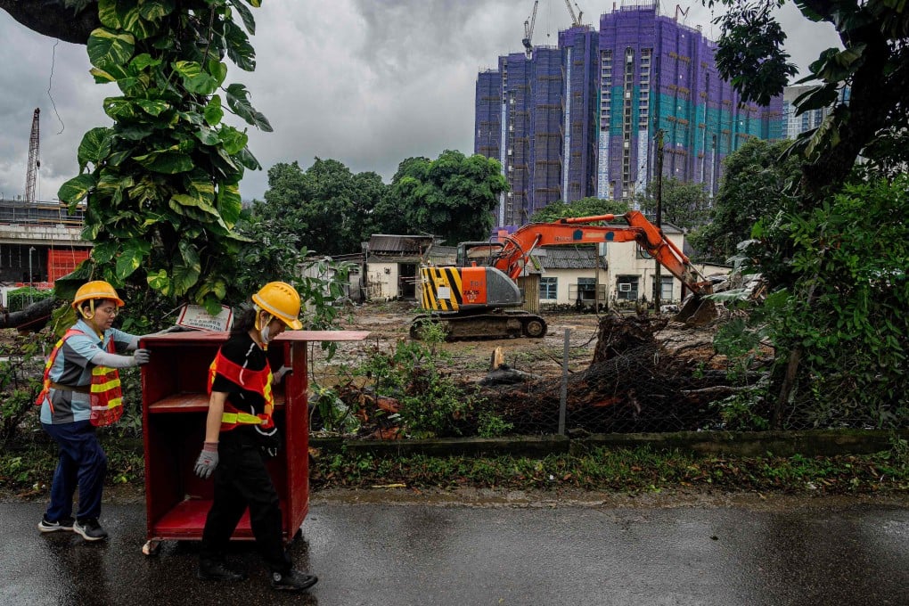Workers remove belongings from a demolition site in Kwu Tung on June 17 to make way for developments under the the Northern Metropolis plan. Urban policy research can bring future and existing residents’ expectations into planning and identify problems while there is still time to change course. Photo: AFP