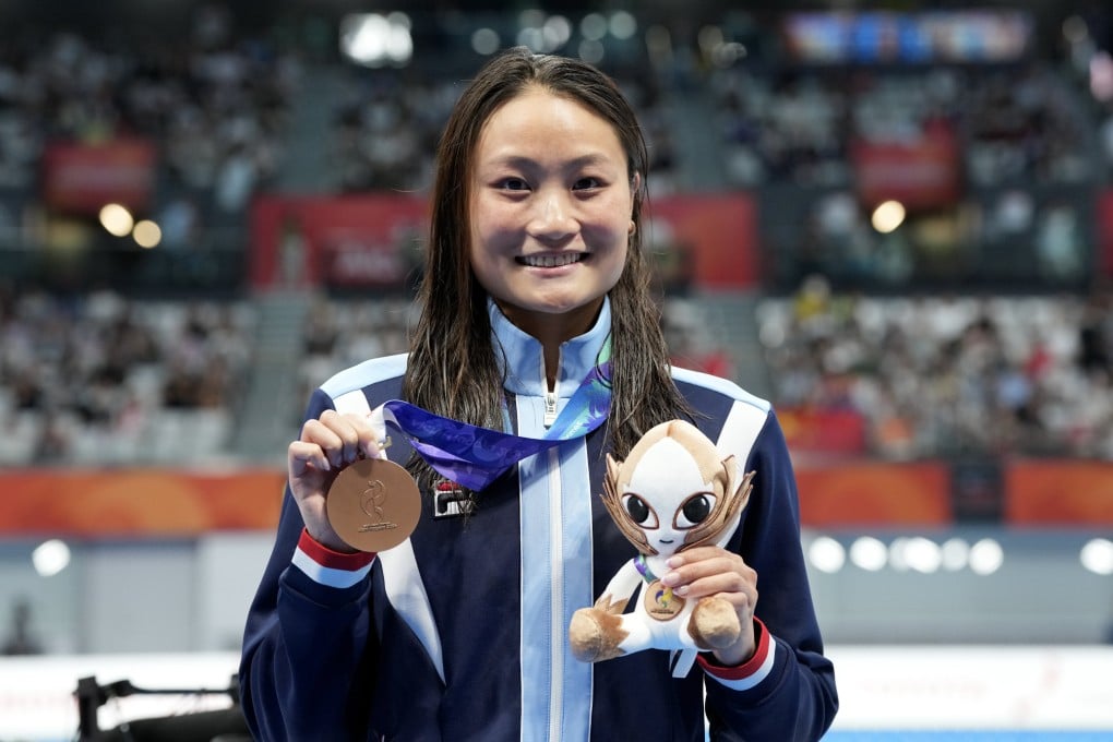 Hong Kong’s Natalie Kan wins bronze in the women’s 100m butterfly at the Asian Games. Photo: Robert Ng