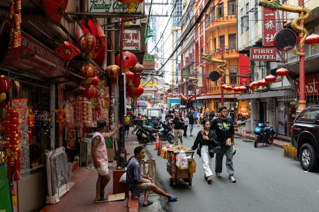 People walk at Binondo, the world’s oldest Chinatown, in Manila, the Philippines, in August. Photo: Reuters