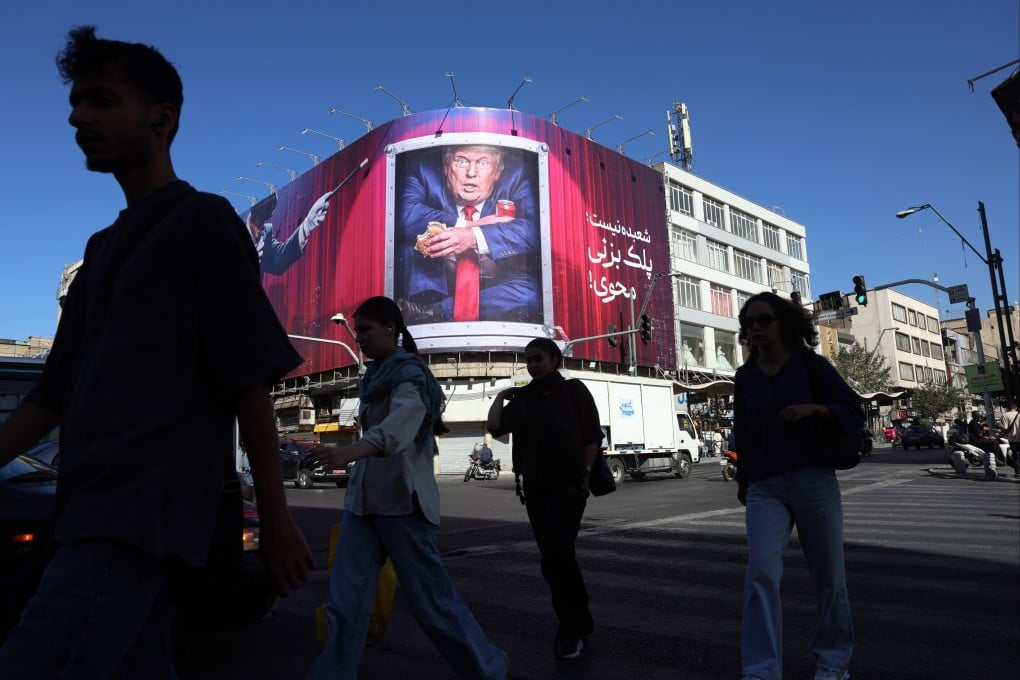Iranians walk past an anti-Trump billboard on a street in Tehran on September 23. In a speech at the UN General Assembly, US President Donald Trump asked aloud whether he should “annihilate the Islamic Republic and do it quickly”. Photo: EPA