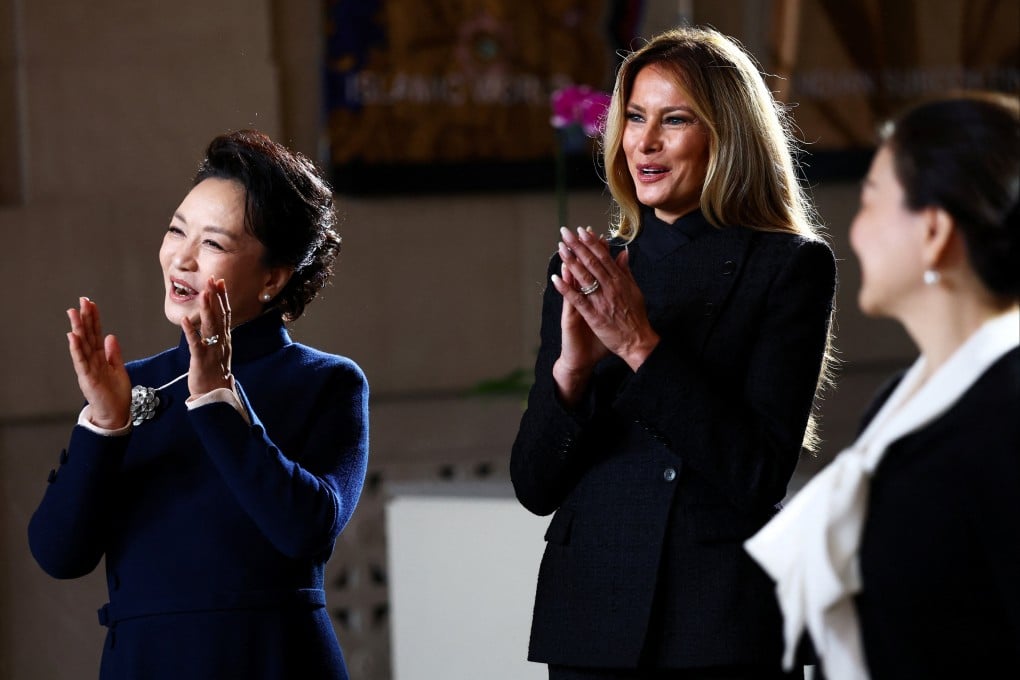 First lady of China Peng Liyuan and her US counterpart Melania Trump react as choir students perform at the Smithsonian’s National Museum Of Asian Art. Photo: Reuters