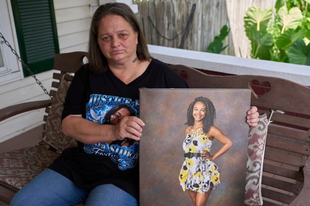 Christy Spivey poses with a portrait of her late daughter Tasia Fortune in Marion, Kentucky, on September 8. Photo: AP