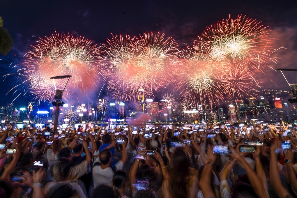 People gather at the Tsim Sha Tsui waterfront to watch the National Day fireworks show last year. Photo: Elson Li