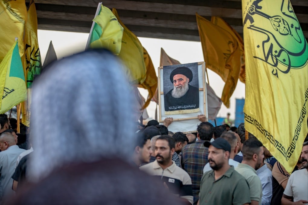 A demonstrator holds a portrait of Iraq’s top Shiite cleric, Grand Ayatollah Ali al-Sistani, during a protest against the suspension of flights between Iraq and Iran outside Najaf International Airport in Najaf, Iraq on Monday. Photo: AP