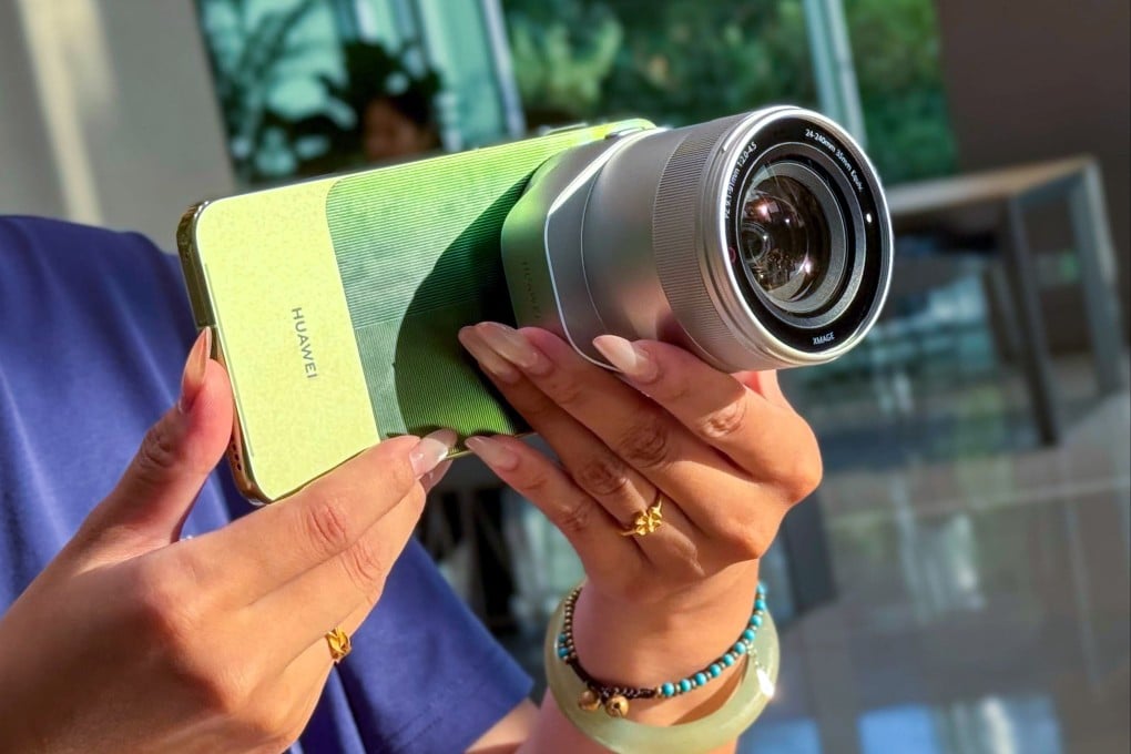 A salesperson showcases the Huawei Mate 90 Pro Max Premium Edition at a store in Shenzhen on Tuesday. Photo: Iris Deng