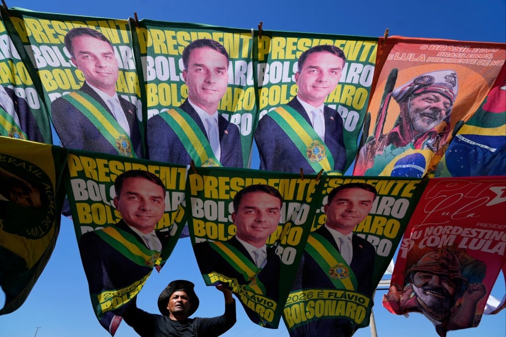 A street vendor sells campaign flags of candidates Flavio Bolsonaro and current President Luiz Inacio Lula da Silva. Photo: AP