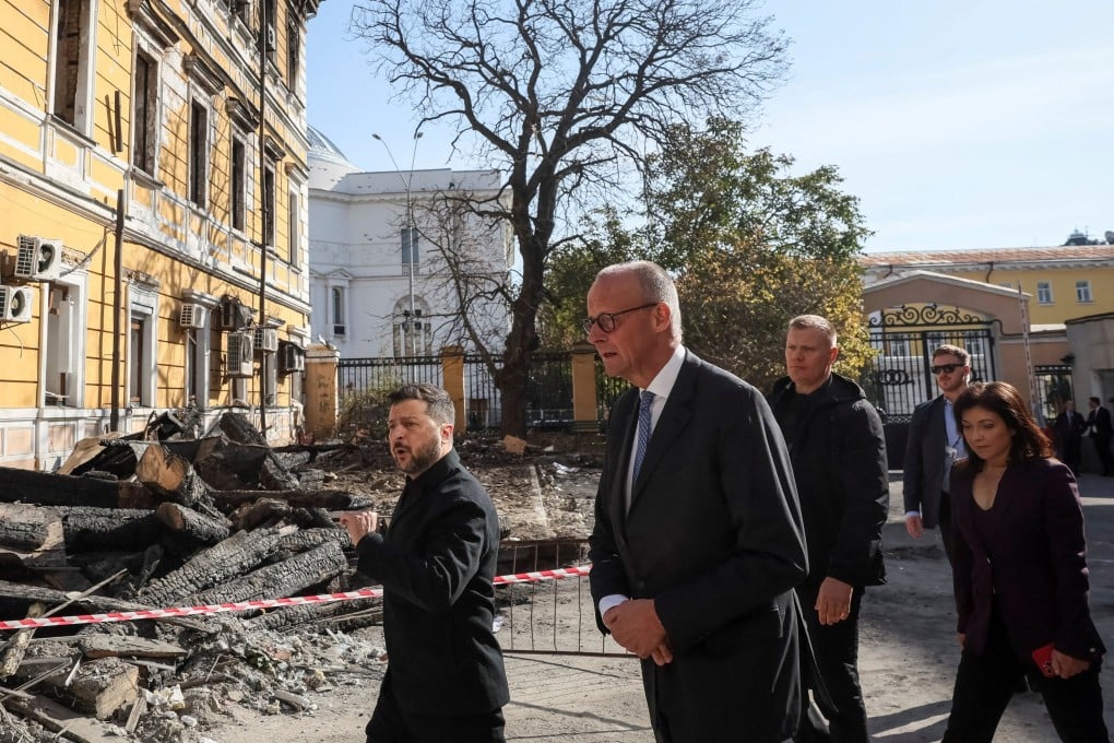 Ukraine’s President Volodymyr Zelensky (centre), German Chancellor Friedrich Merz (centre-right) and German Energy Minister Katherina Reiche (right) visit the site of an administrative building of Ukraine’s National Academy of Sciences hit during recent Russian drone strikes, amid Russia’s invasion of Ukraine, in Kyiv on Sunday. Photo: Reuters