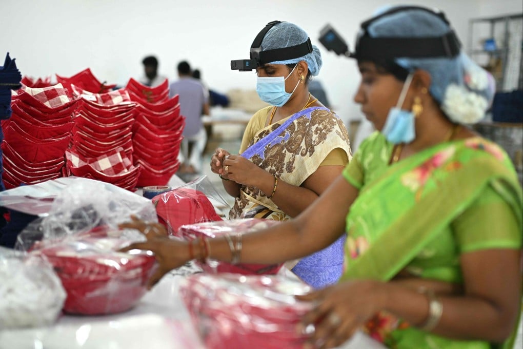 Workers wearing GoPro cameras on their heads to record actions in a factory in Tamil Nadu’s Karur district in India on May 13. Developers think feeding such footage into specialised AI models will help robots copy humans. Photo: AFP