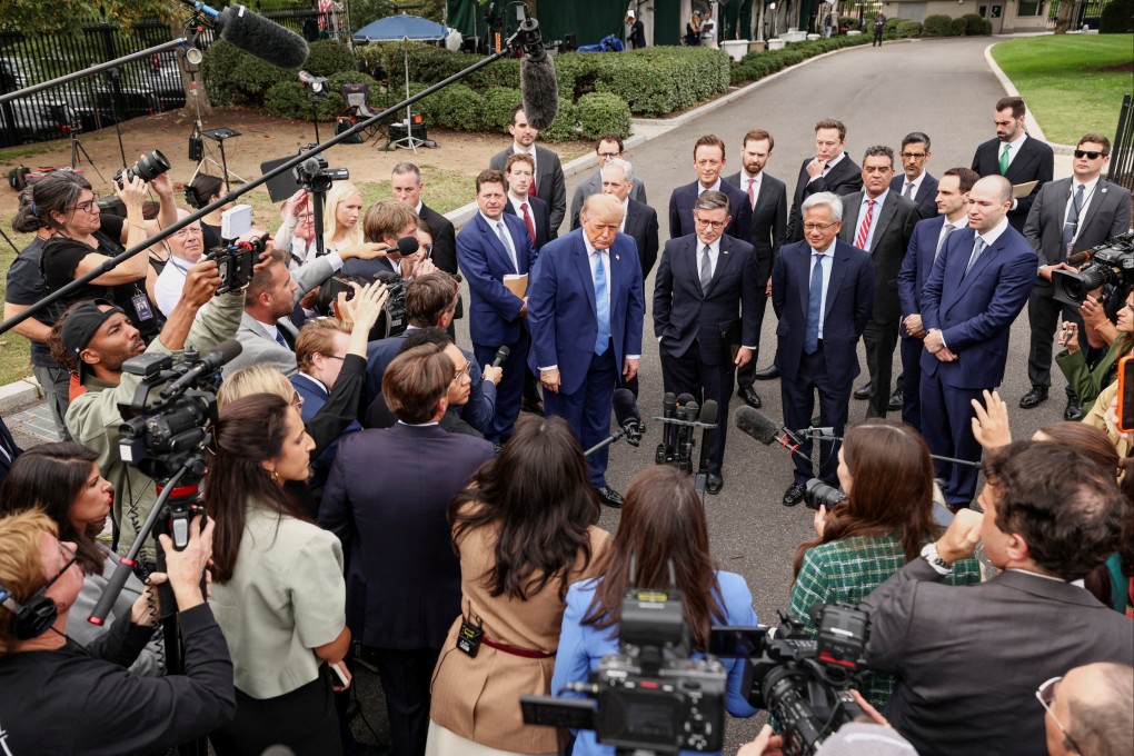 US President Donald Trump, standing with Meta CEO Mark Zuckerberg, US House Speaker Mike Johnson, Nvidia CEO Jensen Huang, OpenAI president Greg Brockman and other tech leaders, speaks to the media at the White House driveway in Washington, on September 29. Photo: Reuters
