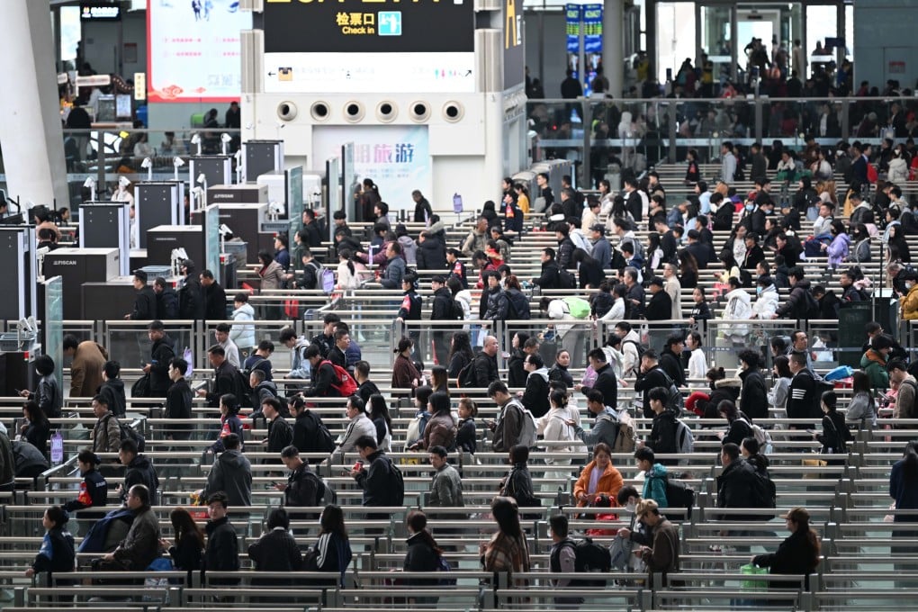 Passengers queue at Guangzhou South Railway Station in China’s southern province of Guangdong. Photo: Xinhua