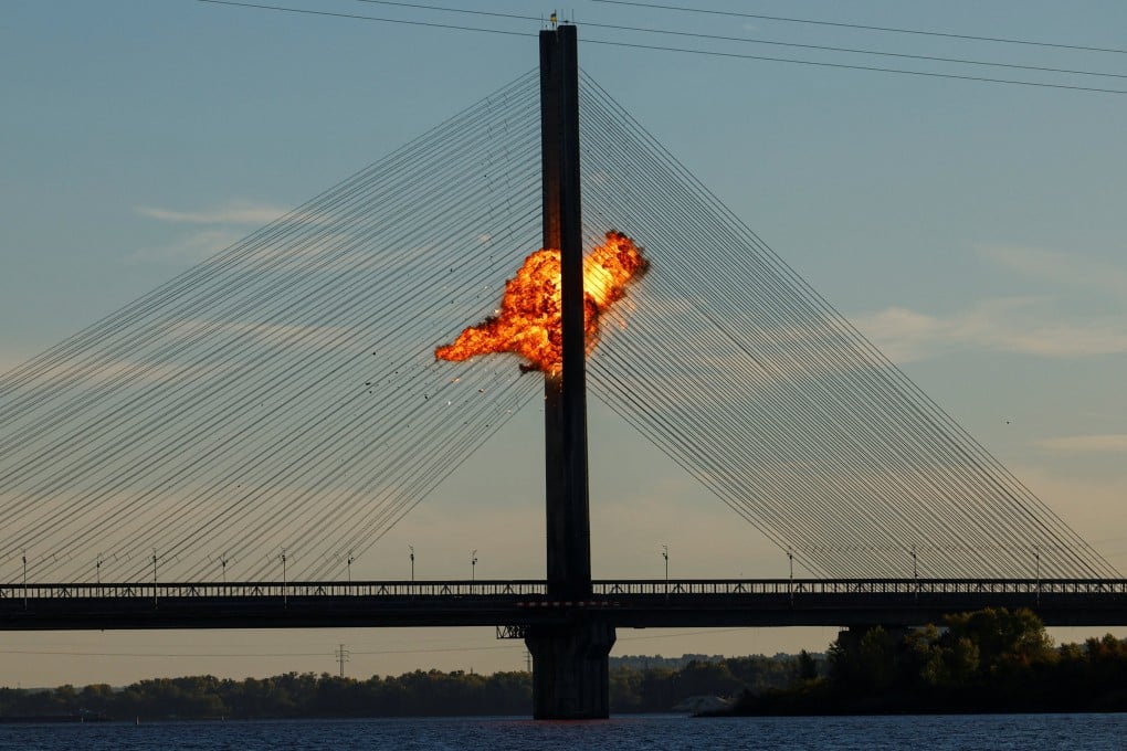 A Russian jet-powered drone hits a bridge in Kyiv on Friday as both sides escalate long-range attacks. Photo: Reuters