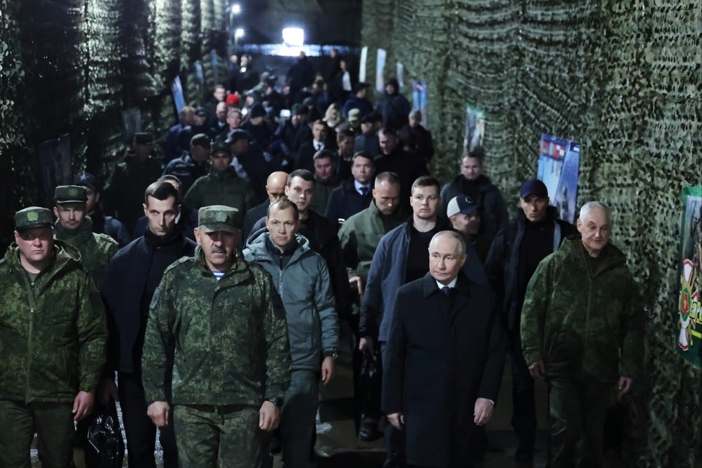 Russian President Vladimir Putin, accompanied by Deputy Defence Minister Yunus-Bek Yevkurov on his right and Russian Defence Minister Andrei Belousov on his left at the Tsentr-2026 military exercises at the Chebarkulsky training ground in the Chelyabinsk region of Russia on October 2. Photo: Kremlin Pool Photo via AP