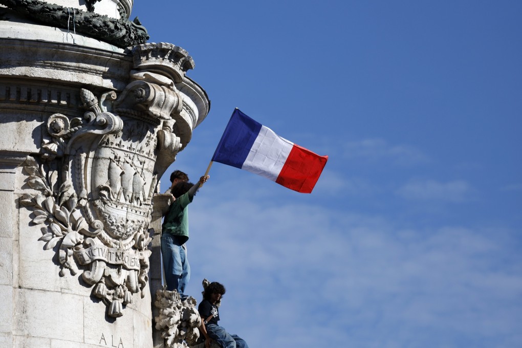 Young people engage in a protest over school conditions at Place de la Republique in Paris on Tuesday. Photo: EPA
